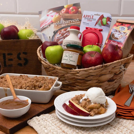 Delight in the essence of autumn with our Apple Essence Harvester Gift Basket, the perfect gift for fall-loving hearts!  Packed with juicy red and green apples, spiced apple cider concentrate, sweet and salty caramel sauce, and a heartwarming Apple Harvest book filled with delicious recipes and wonderful stories about the history of cooking with apples.