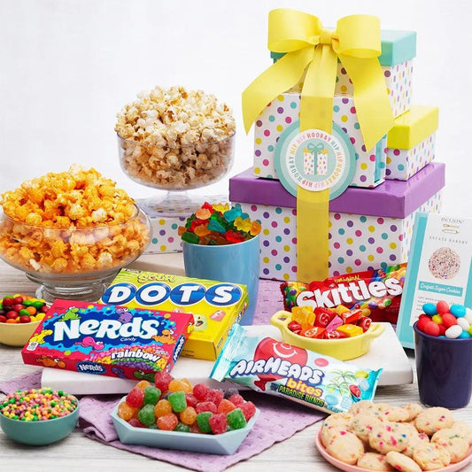Say “Happy Birthday” with this festive birthday-themed gift tower. Bright and cheery boxes are filled with our favorite birthday celebration treats. To please their sweet tooth, we’ve artfully arranged gourmet popcorn and fruity candy inside the box tiers. This gift is sure to make their birthday a memorable one!