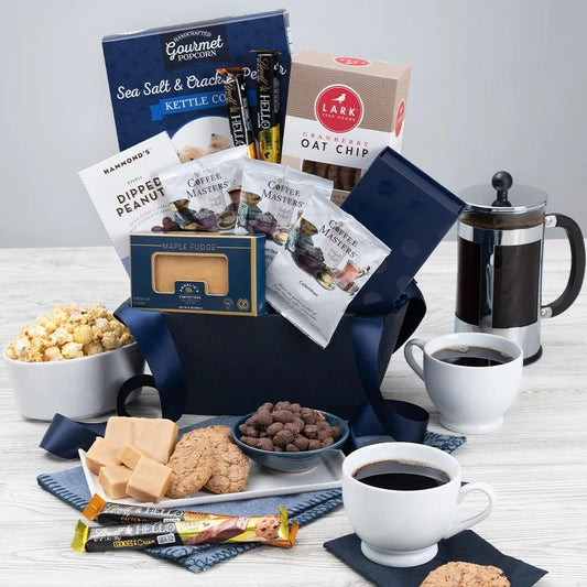 Delight the coffee lover in your life with this Coffee Chocolateer Classic gift basket! Inside a beautiful basket, your recipient will discover an impressive collection of tempting chocolates and premium coffees that are impossible to resist. Boasting deliciously crisp cookies, chocolates, premium ground coffee, and more, this sophisticated arrangement is guaranteed to take any coffee break to the next level!