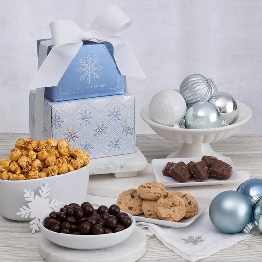 This festive mixed-pattern gift tower is just what the doctor ordered to spread joy and cure the winter blues! Each beautiful box contains gourmet snacks like handcrafted caramel popcorn, peanut butter chocolate chip cookies, and dark chocolate sea salt caramels. Your gift recipient will forget their worries while enjoying the delivery of these delicious treats!