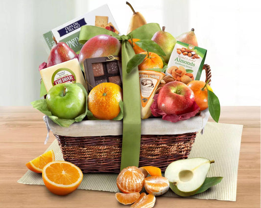 Fresh Fruit Snacker Gift Basket: A gourmet assortment of fresh fruit with sweet and savory snacks compliment traditional mango, pears, apples, oranges and mandarins. Presented in a hand woven keepsake basket. The perfect gift for a family or large gathering.