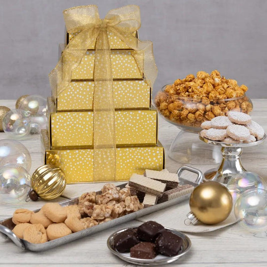 Simple and sophisticated, this Golden Gourmet Holiday Gift Tower is elegant in both appearance and taste! Inside each of the five gift box layers, we've arranged an assortment of our favorite gourmet treats, like salted caramel cookies, zesty and sweet lemon coolers, sea salt caramels, butter peanut crunch, and the crispiest handcrafted caramel popcorn, to create a stunning gift that's as pleasing to the eye as it is to the palate!   
