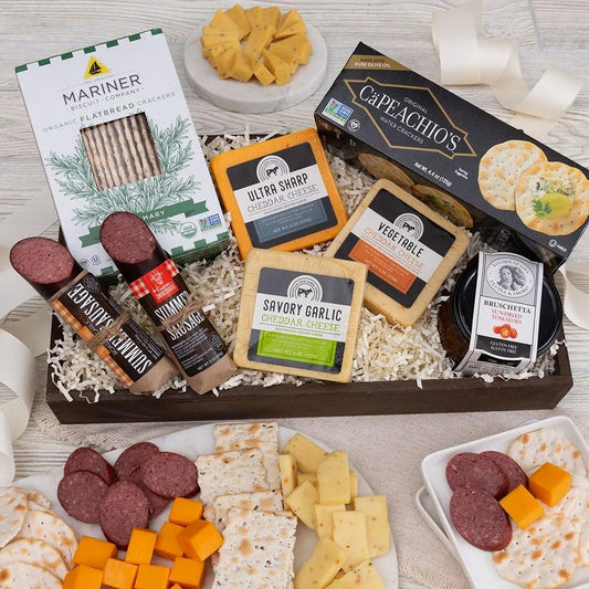 This deluxe gourmet meat and cheese sampler features a carefully selected assortment of artisan meats, cheeses, and crackers. From roasted garlic and summer sausages to three flavors of savory gourmet cheese, this is the perfect gift to send for any occasion. They'll have fun pairing the different meats and cheeses with the hearty crackers and sun-dried tomato bruschetta!