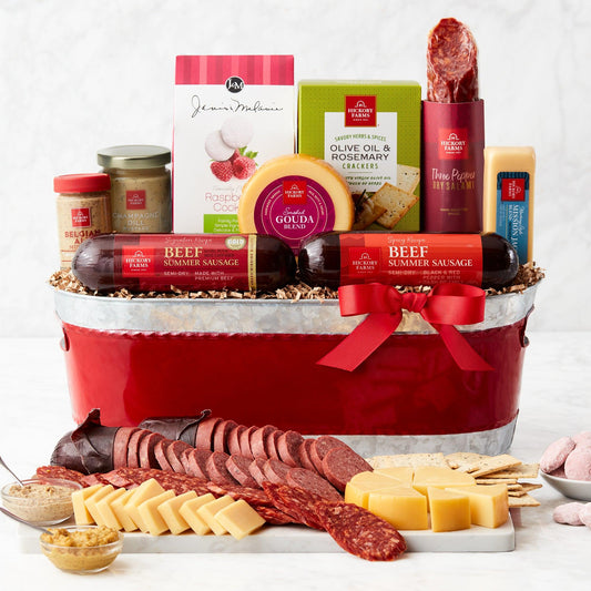 Gourmet Spirit Holiday Gift Basket - Put everyone into the spirit of the season with this cheerful holiday gift basket. It’s full of popular flavors including savory and spicy sausages, salami, cheeses, mustards, crackers, and cookies. There’s lots of holiday cheer to share, making it a great gift for couples, families, or hosts.