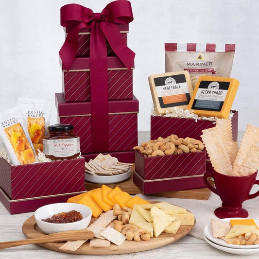 The Holiday Cheese and Cracker Gift Tower is a festive delight that embodies the joy of gift-giving. Unlock a world of irresistible flavors with the carefully curated selection of fall and winter goodies.  This gift is packed to the brim with two delectable varieties of cheese, artisanal crackers that add the perfect crunch, zesty hot pepper jelly to tantalize the taste buds, and roasted cashews for a satisfying snack experience.