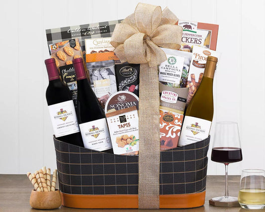Kendall-Jackson Red and White Wine Trio Gift Basket:  Kendall-Jackson Vintner's Reserve wine grapes are grown in cool coastal vineyards, giving their California winemakers a broad palette of flavors to work with.  America's best selling chardonnay is creamy and balanced with hints of vanilla; robust Sonoma cabernet, earthy pinot noir and a curated selection of gourmet food including crackers, cheese wedges, milk and dark chocolate, olives, cookies and more are sure to please.