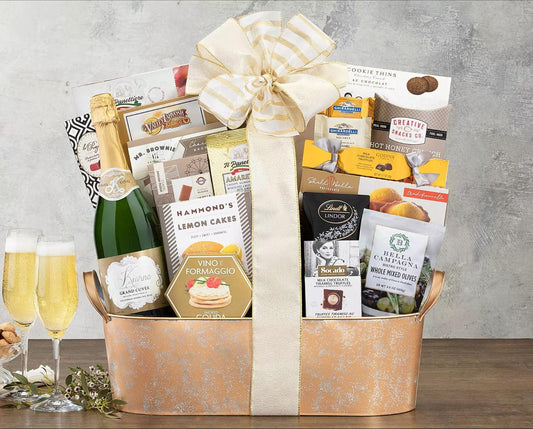 Kiarna Sparkling Grand Cuvee Gift Basket: This refined champagne gift basket with Kiarna sparkling grand cuvee is made for celebrating.  A collection of Godiva milk chocolate truffles, lemon cakes, cherry strudel, Vine e Formaggio smoked Gouda cheese spread, spicy honey crunch snack mix, sesame crackers and more completes this sparkling gift collection.