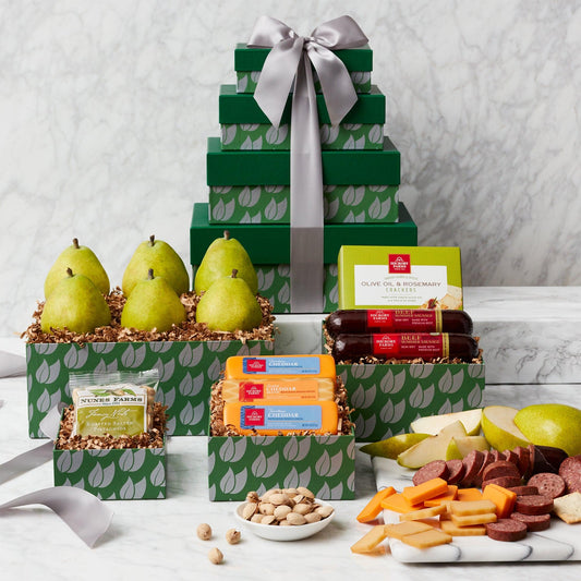 Peary Christmas Charcuterie Gift Tower - Wish someone happy holidays in style with this delicious gourmet gift. Specially designed green boxes are filled with the best of the season, including sausage, cheese, crackers, pistachios, and fresh pears. This tower makes a memorable gift to share at an office party, family gathering, or as a host gift.