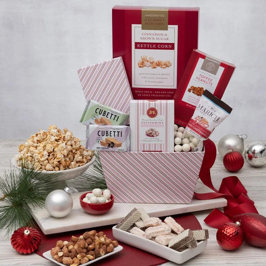 Celebrate the magic of Christmas and spread holiday cheer with our Peppermint Christmas Magic Gift Basket!  This enchanting gift captures the season's essence, combining irresistible treats and festive flavors that are sure to delight. Indulge in the sweet crunch of kettle corn, savor the light and delicious wafer cookies, and enjoy the refreshing pepp