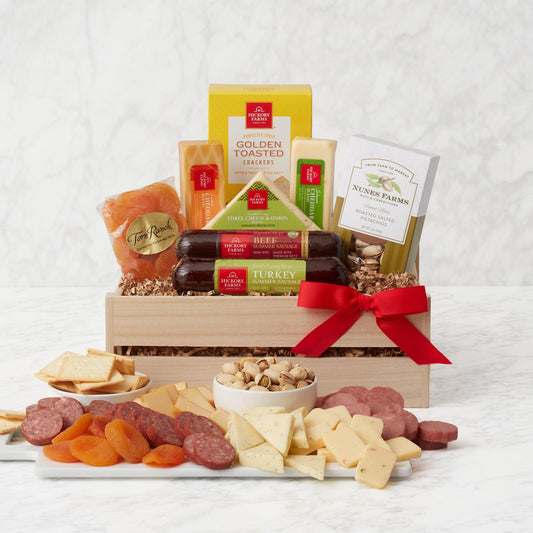 Smoked Spiced and Savory Charcuterie Gift Crate - Smoky, spicy, and savory, this gift has a delicious combination of flavors that pair perfectly. Two types of sausages are deliciously complemented by savory cheeses, and along with the flavor and crunch of crackers and nuts, plus a touch of sweetness for a delicious charcuterie board anyone can enjoy.