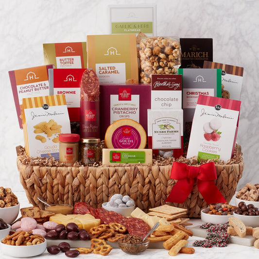 Snack Lover Spoiler Gift Basket - Spoil the snack lover on your holiday gift list with this bountiful basket of treats! It features dry salami, cheese, mustard, gourmet condiments, crisps, and flatbread to create a savory meat and cheese board. It's finished off with a selection of sweets like cookies, chocolate covered fruit and nuts, candies, biscotti, caramel corn, and pretzels. This gift basket is overflowing with plenty of snacks to share, making it a great pick for a large group or the office.
