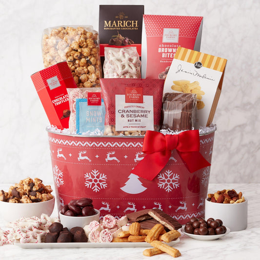 'Tis The Season Holiday Gift Basket - Share a festive collection of treats this holidays season. Our holiday-print gift basket is filled to the brim with snacks like nut mix, mints, chocolate grahams, chocolates, chocolate covered fruit, pretzels, and caramel corn. Send as a thoughtful holiday gift for the office or family.