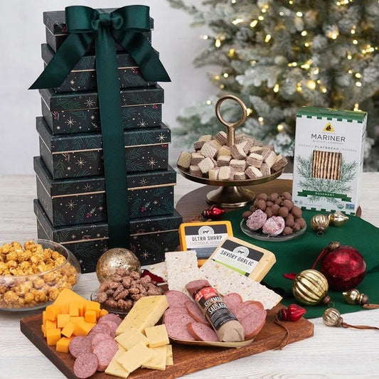 Celebrate the magic of the winter holiday season with our delightful Winter Bells Meat and Cheese Gift Tower. Spread cheer with six beautifully designed gift boxes filled with exquisite gourmet treats.  Every layer of this tower offers a tantalizing surprise, from delectable cookies to mouthwatering popcorn, from irresistible double-dipped peanuts to creamy cheese with crackers.